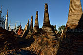 Inle Lake Myanmar. Indein, on the summit of a hill the  Shwe Inn Thein Paya a cluster of hundreds of ancient stupas. Many of them are ruined and overgrown with bushes. 